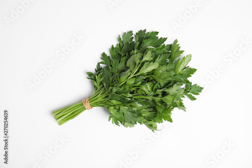 Bunch of fresh green parsley on white background, top view photo