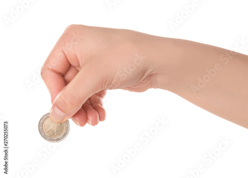 Woman holding coin in hand on white background, closeup