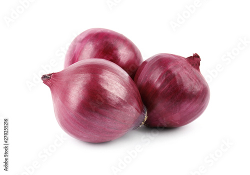 Fresh whole red onions on white background