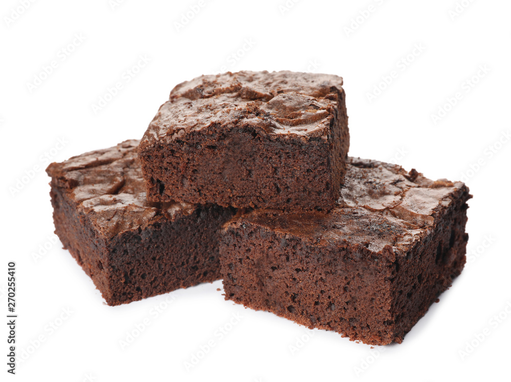 Pieces of fresh brownie on white background. Delicious chocolate pie