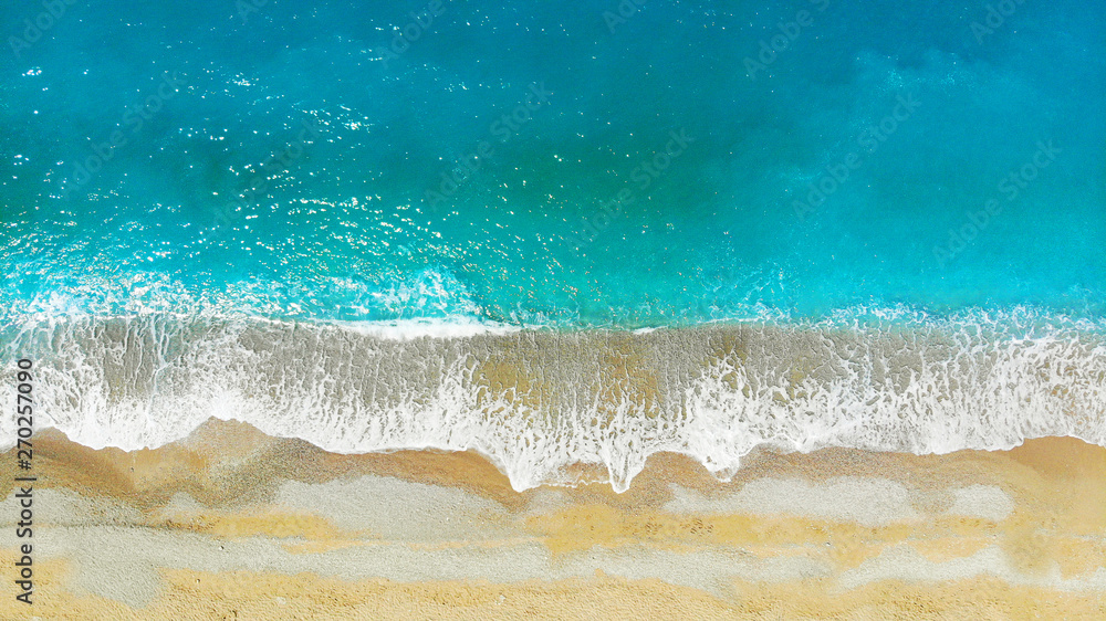 Aerial. Mediterranean sea waves background texture. Turquoise water top view.