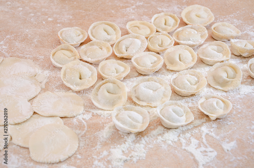 homemade dumplings on the kitchen table. Grandma's delicious dumplings. homemade dumplings on the kitchen table. Grandma's delicious dumplings.