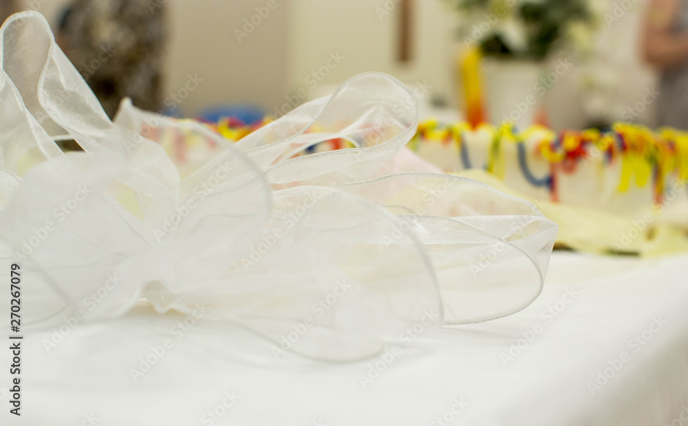 Colorful laced ribbon on cake table Colorful laced ribbon on cake table