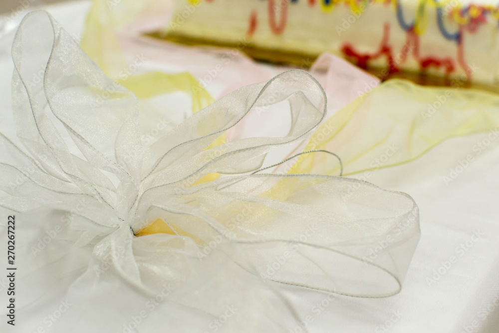 Colorful laced ribbon on cake table Colorful laced ribbon on cake table