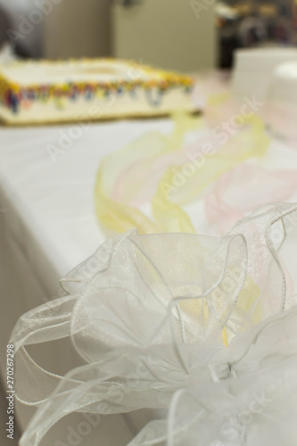 Colorful laced ribbon on cake table