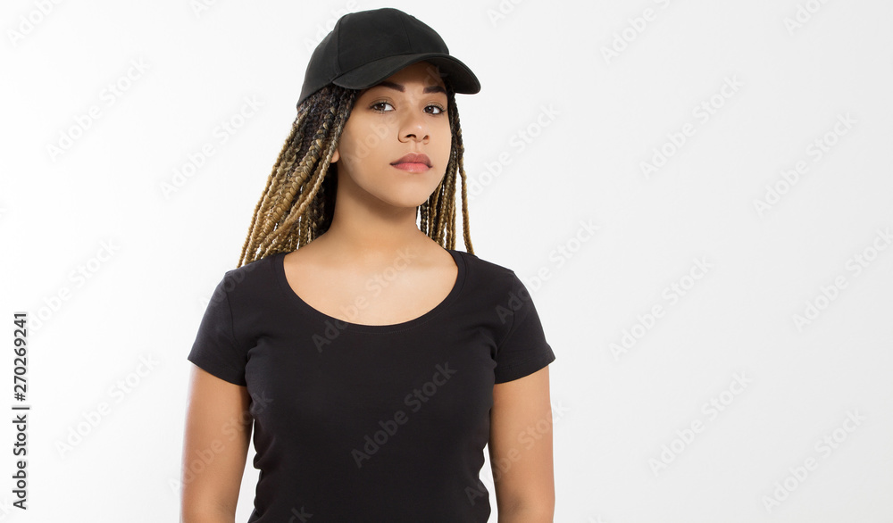 Template blank black t shirt and baseball hat. African american woman in summer clothes with copy space isolated on white background. Afro hairstyle. Mock up, place for print. Closeup girl front view Template blank black t shirt and baseball hat. African american woman in summer clothes with copy space isolated on white background. Afro hairstyle. Mock up, place for print. Closeup girl front view