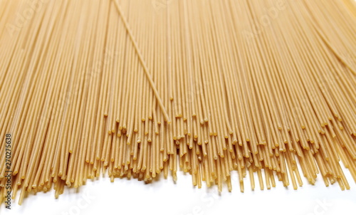 Integral spaghetti  yellow pasta isolated on white 