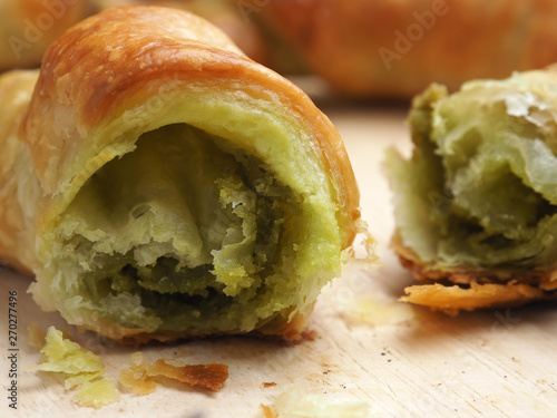 Croissants with matcha on wood