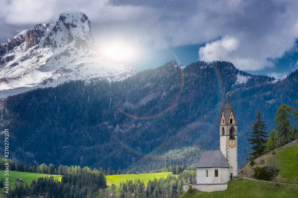 Magnificent summer sunset in Tirol. Chapel of St. Mary Magdalene