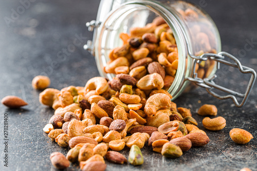 Bild auf Leinwand Spicy flavoured nuts. Mix of nuts.