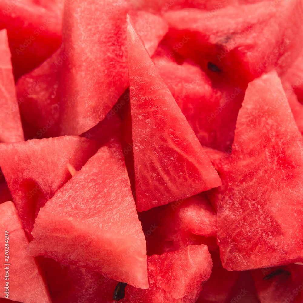 Fresh red watermelon pieces closeup, summer background Fresh red watermelon pieces closeup, summer background