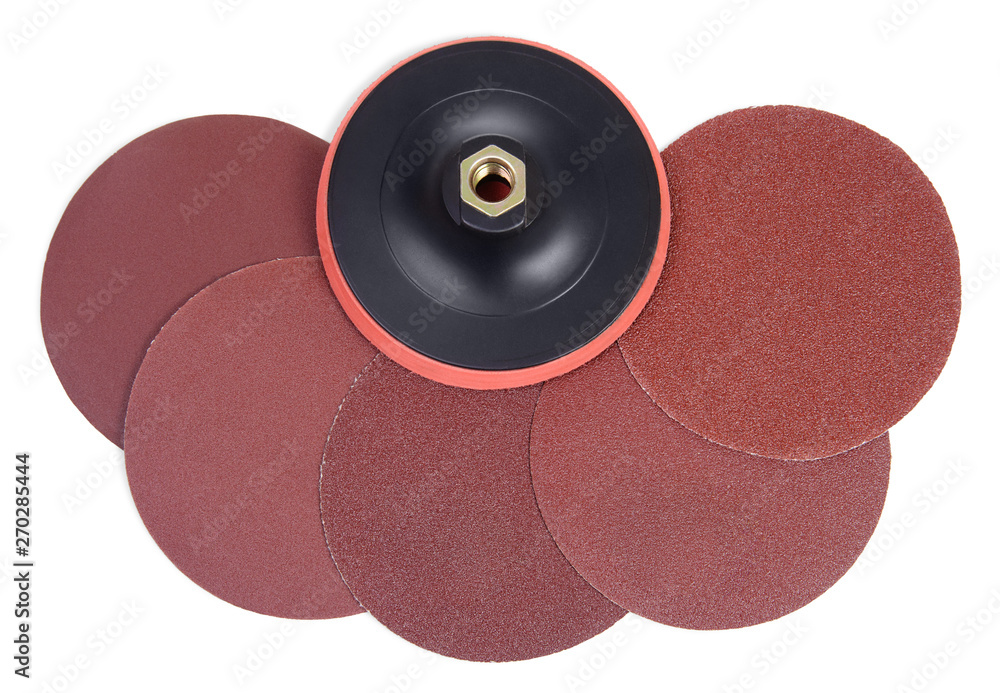 Set of round sandpaper discs with different grain types and plastic
