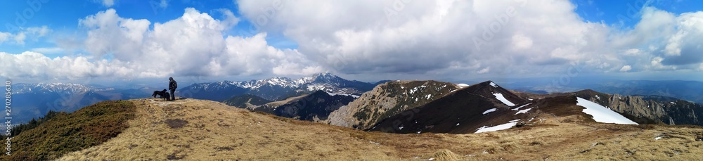 Panoramic mountains landscape in early spring - snow in the mountains 