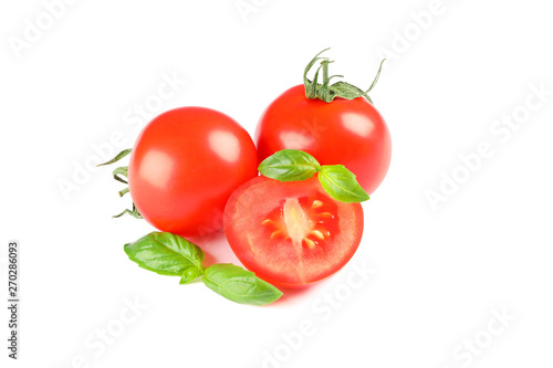 Fresh cherry tomatoes with basil isolated on white background. Ripe vegetables