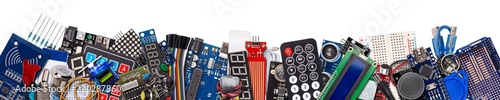 wide panorama banner collage with copy space of microcontroller board display sensor button switches cable wire accessories and equipment electronics concept panorama isolated white background photo