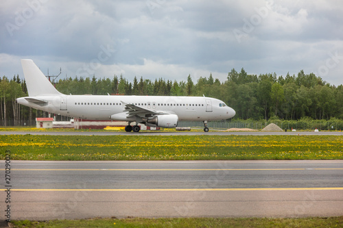 white passenger plane lands at the airport