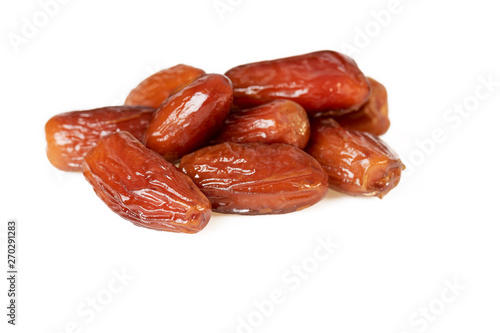 Sweet dates fruit or pile of dried dates isolated on white background