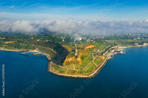 aerial view to green cape with city behind in the fog in Odessa in Ukraine