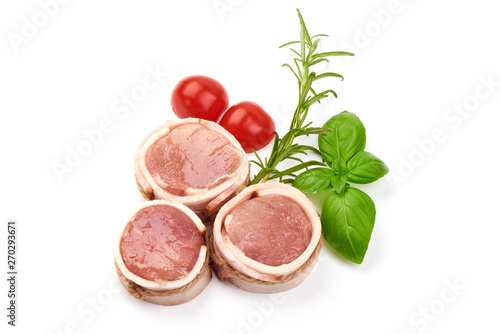 Fresh and juicy pork medallions wrapped in bacon, top view, isolated on white background