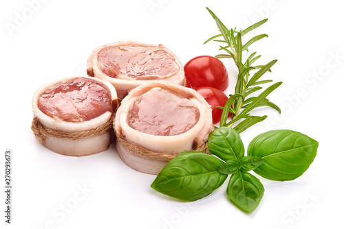 Raw meat medallions wrapped in bacon, close-up, isolated on white background photo