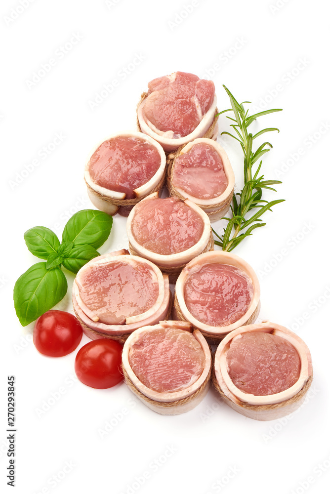 Raw meat medallions wrapped in bacon, top view, isolated on white background Raw meat medallions wrapped in bacon, top view, isolated on white background