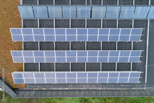 Aerial view of house with solar panels on the roof. clean energy