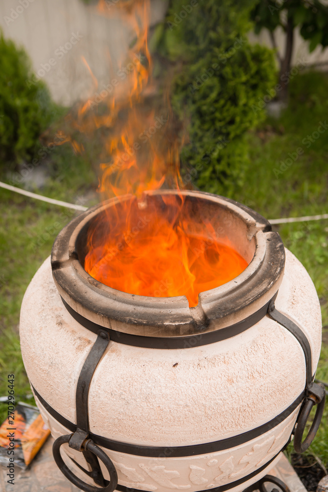 tandyr oven close up photo on the summer outdoor green garden background tandyr oven close up photo on the summer outdoor green garden background