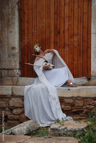 Dancers performing ancient Greek dances near the Acropolis of Athens. Greece, October 2019. 