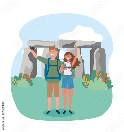 woman and man couple taking a picture with backpack