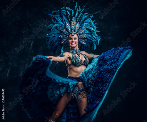 Konstfotografi Festive smiling can can dancer in blue costume is showing her perfomance