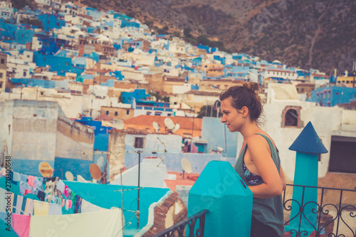 tourist traveling in chefchaouen, Morocco. chefchaouen is famous as to be the blue city of Africa