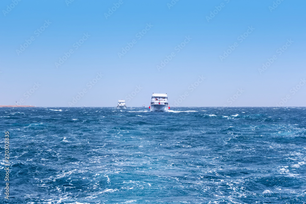 Boat Wave ocean trace on blue sea fresh water background.