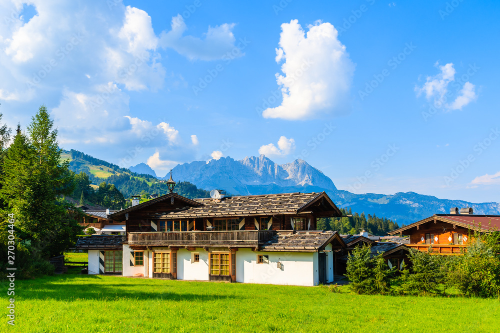 Typical alpine house in countryside landscape near Kitzbuhel town, Tirol, Austria