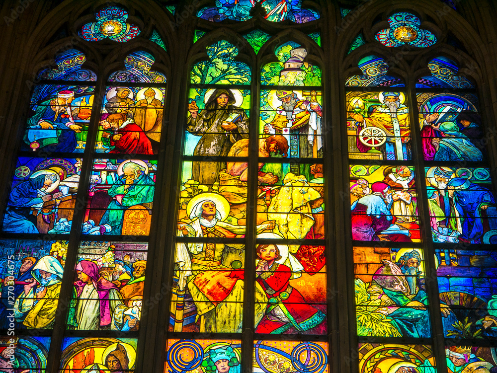 Beautiful stained glass windows in the cathedral of St Vitus in prague Castle in the city of pague in th eCzech Republic