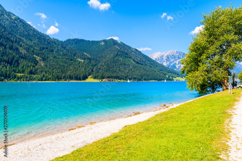 Beach at beautiful Achensee lake on sunny summer day, Tirol, Austria
