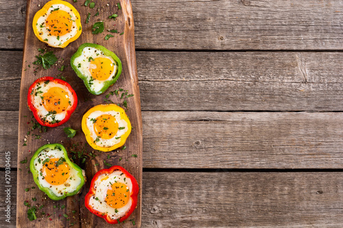 Yellow , red and green pepper with fried eggs