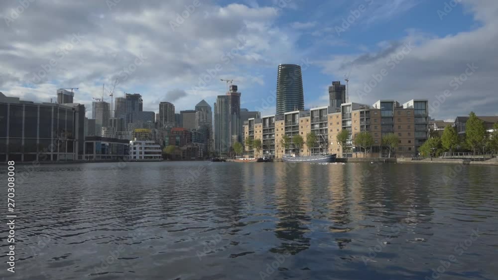 A cityscape and its reflection on a lake. A cityscape and its reflection on a lake.