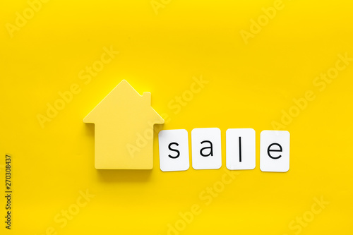 Sale copy with house figure on yellow background top view
