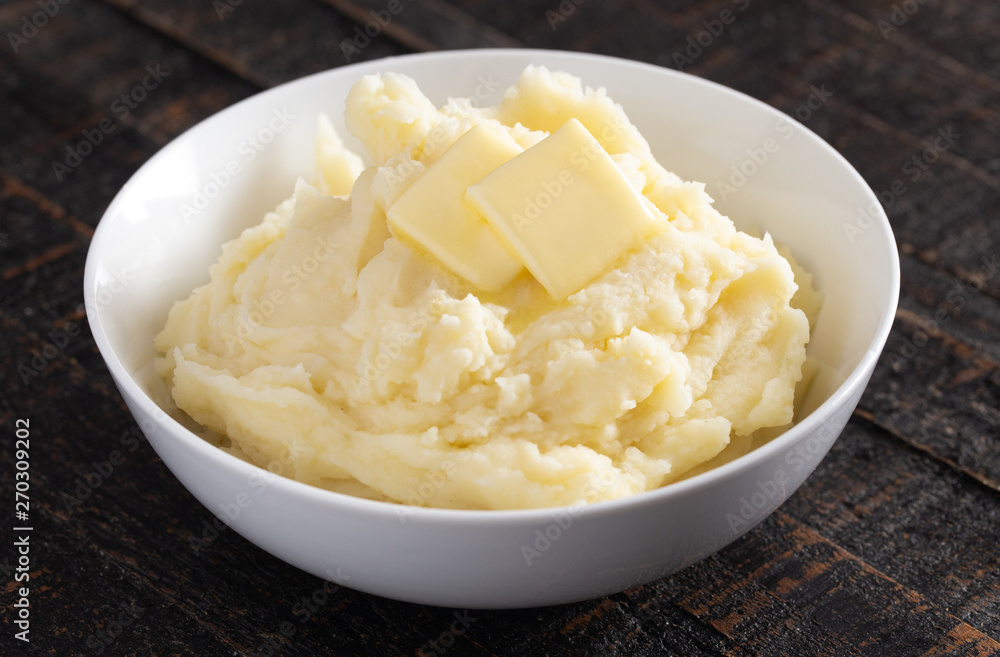 Mashed Potatoes with Butter on a Wooden Table Mashed Potatoes with Butter on a Wooden Table