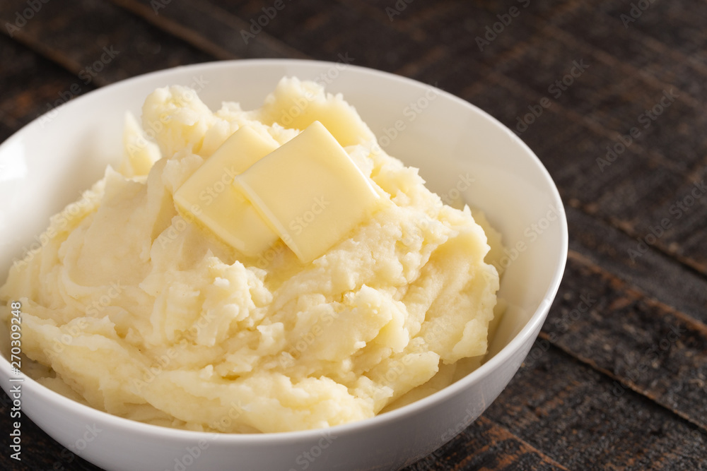 Mashed Potatoes with Butter on a Wooden Table Mashed Potatoes with Butter on a Wooden Table