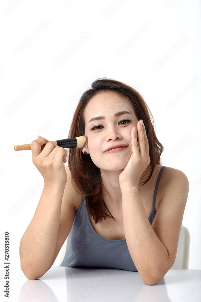 asian woman with make up brush asian woman with make up brush