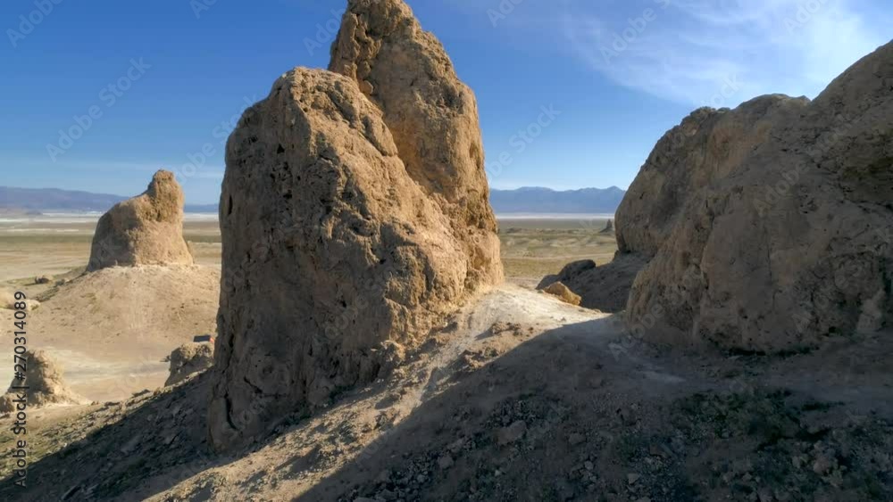 TRONA PINNACLES, CALIFORNIA, USA. Aerial 4K shot of enormous tufas within dry lake bed. Unique geological features in the Mojave Desert. TRONA PINNACLES, CALIFORNIA, USA. Aerial 4K shot of enormous tufas within dry lake bed. Unique geological features in the Mojave Desert.