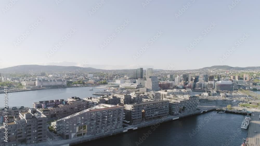 4K aerial with forward motion of the Oslo fjord, downtown Oslo and Bjoervika district, with the new Edvard Munch museum Lambda, Barcode quarter, Soerenga pier and Oslo Opera House. 4K aerial with forward motion of the Oslo fjord, downtown Oslo and Bjoervika district, with the new Edvard Munch museum Lambda, Barcode quarter, Soerenga pier and Oslo Opera House.