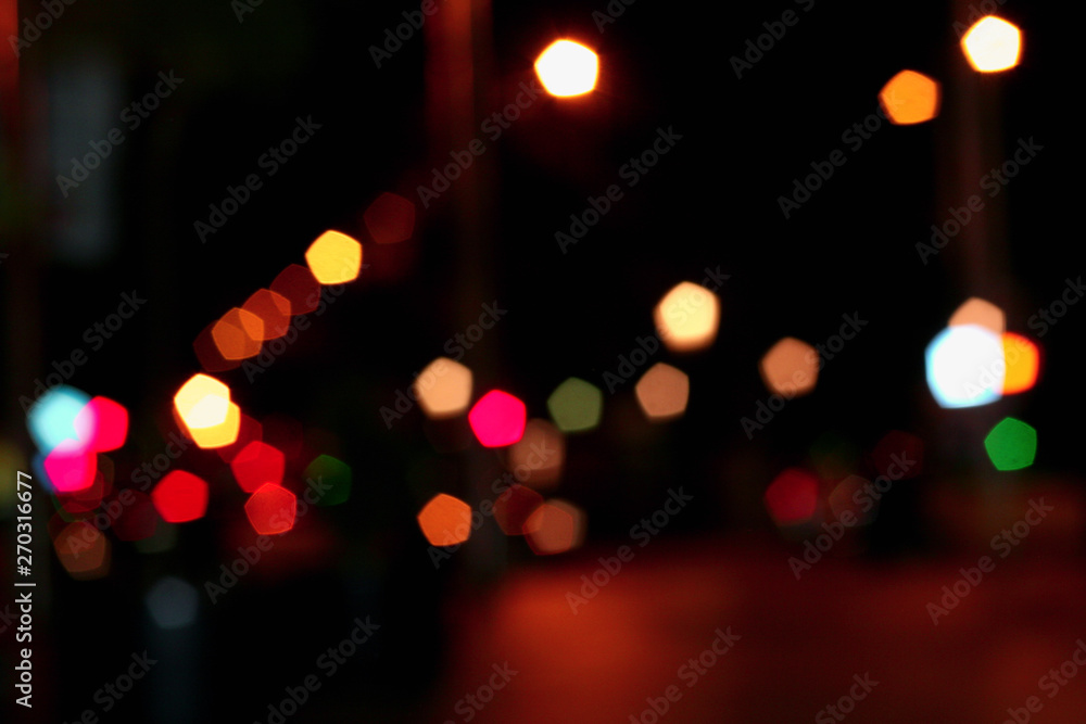 Blurred bokeh background, multicolored lights on dark, night, city streets in lights, glitter lights, background for design Blurred bokeh background, multicolored lights on dark, night, city streets in lights, glitter lights, background for design