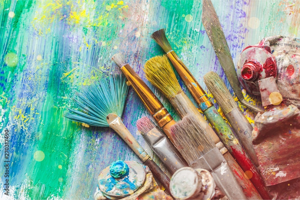 Fototapeta premium Row of artist paint brushes on background