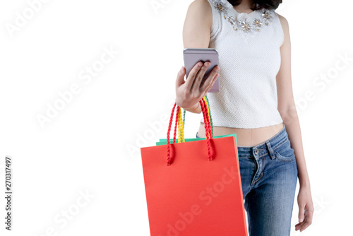 Happy woman in summer enjoying shopping holding smartphone and colorful shopping bag on white background, shopping concept, isolate concept.