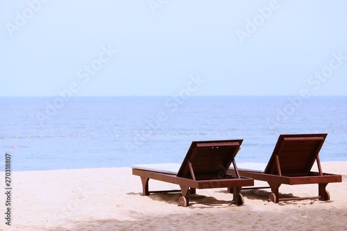 Wooden day bed at the beach closeup summer ocean landscape background © wandeaw