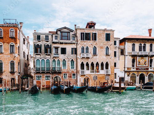 Gondolas and houses in Venice, summer