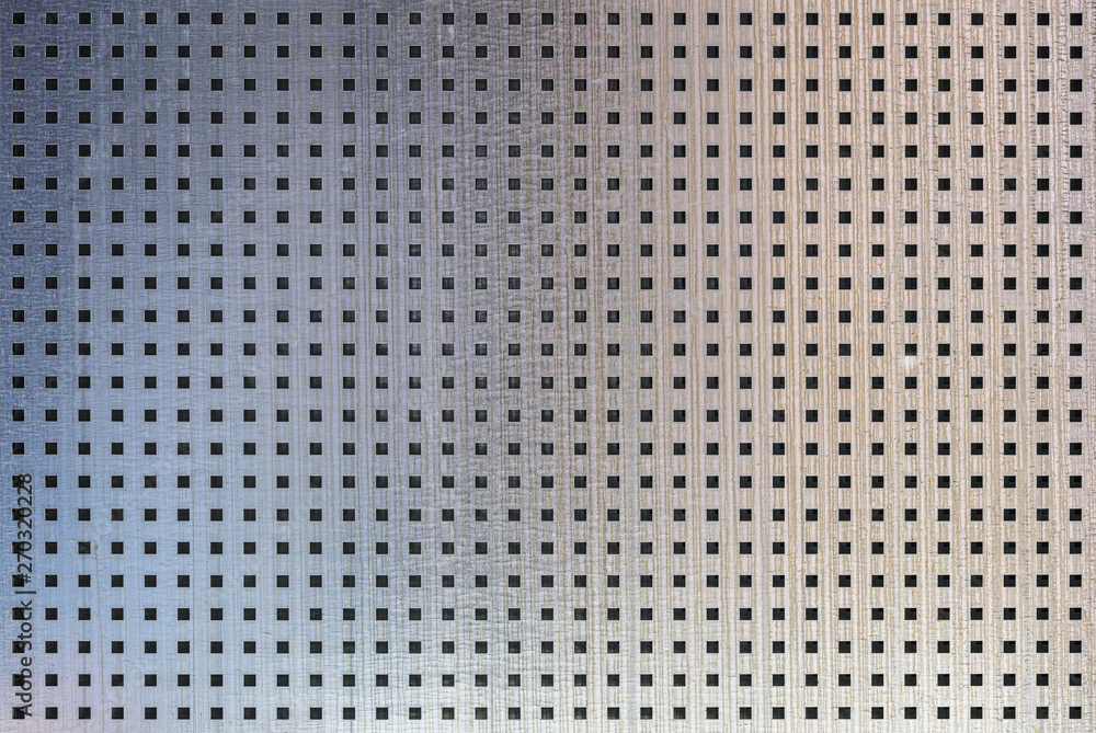 perforated metal seamless texture. sheet of metal covered with square  holes. industrial background Stock Photo