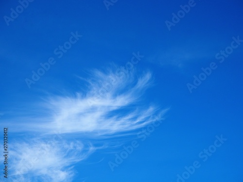 Cirrus clouds on blue sky